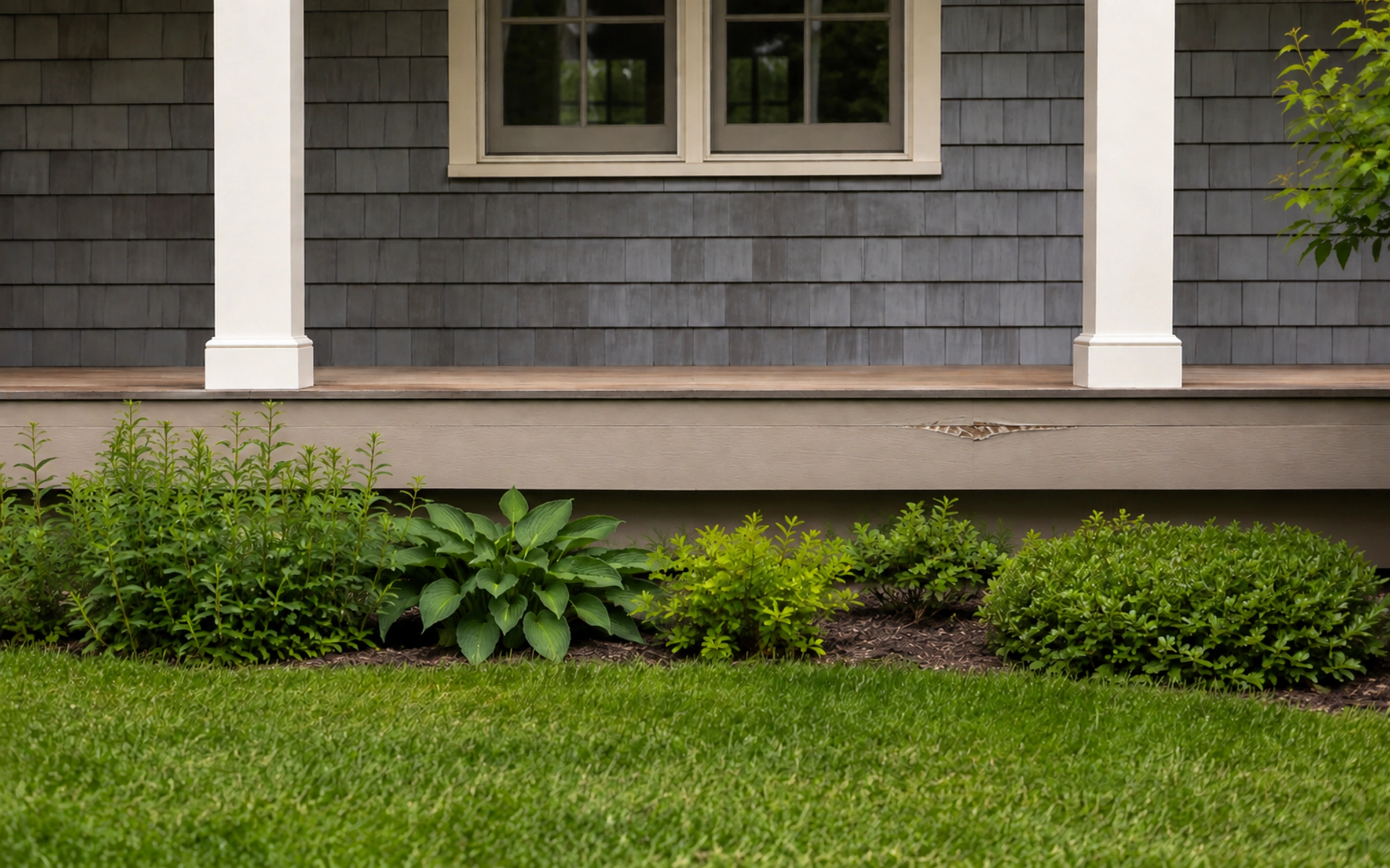 Porch exterior with a localized rough patch on the apron board.